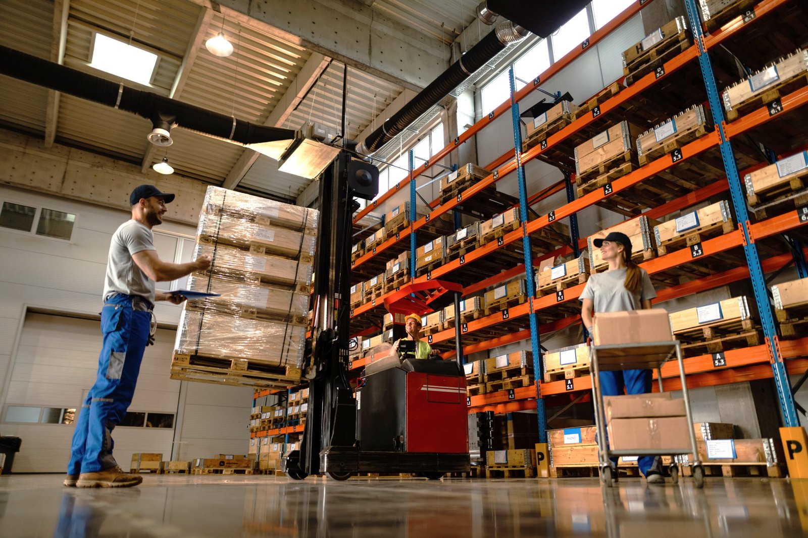 Below view of group of workers cooperating in a warehouse. workers in shipping fulfillment warehouse